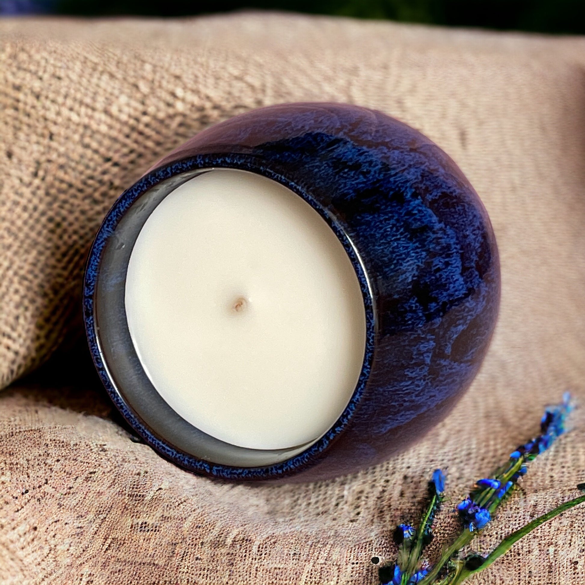 Reset & Unwind candle with natural botanicals, hand-poured with essential oils of geranium, cypress, cedarwood, and ylang ylang