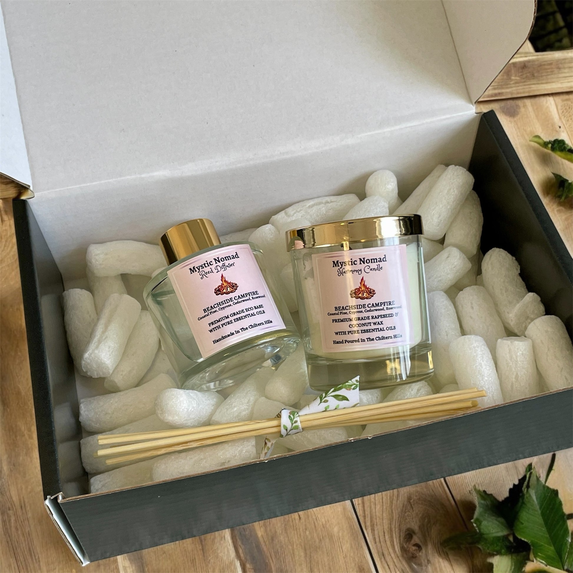 Mystic Nomad Beachside Campfire reed diffuser packaged in eco-friendly postage box, sustainable vegan aromatherapy gift.