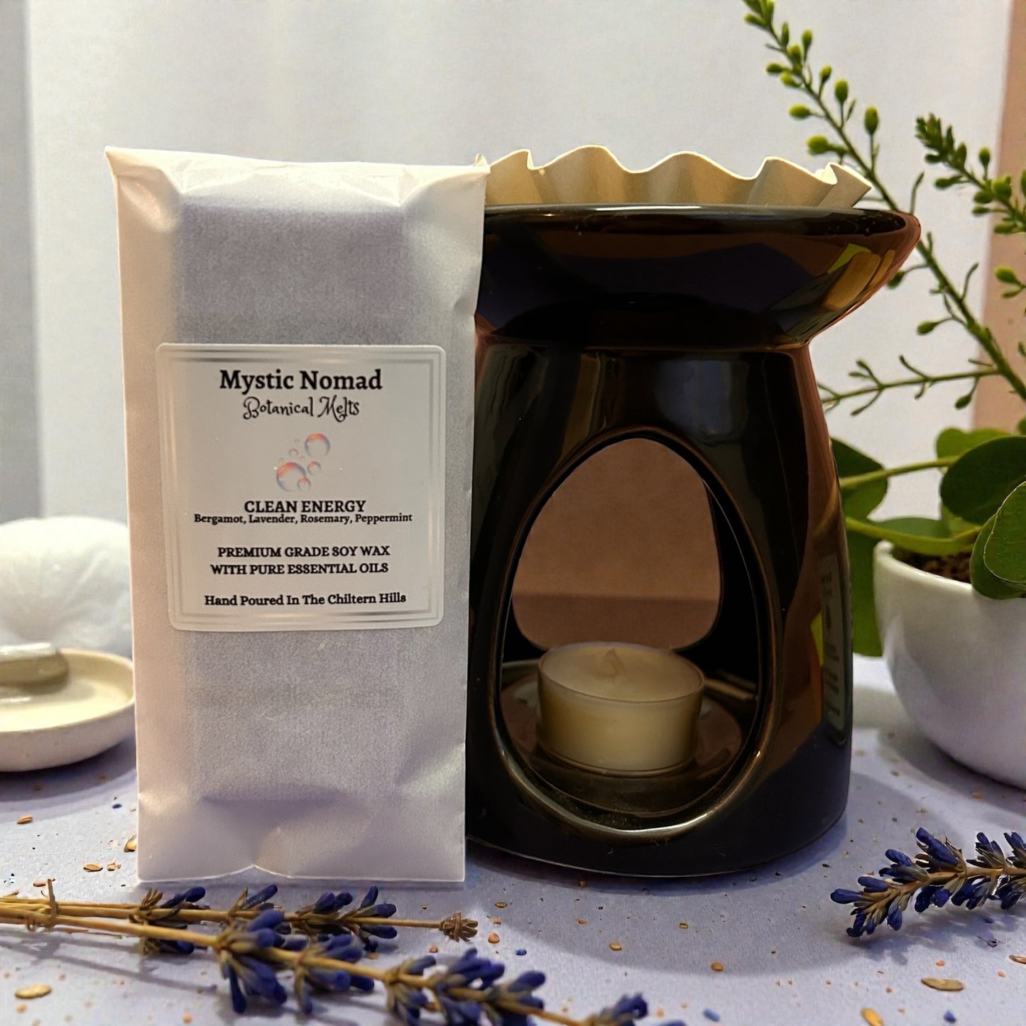 Clean Energy aromatherapy wax melt snap bar with wax melt burner, infused with bergamot, rosemary, lavender, and peppermint for a fresh, uplifting scent