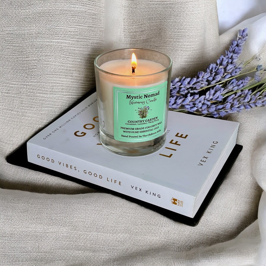 country garden aromatherapy candle on book
