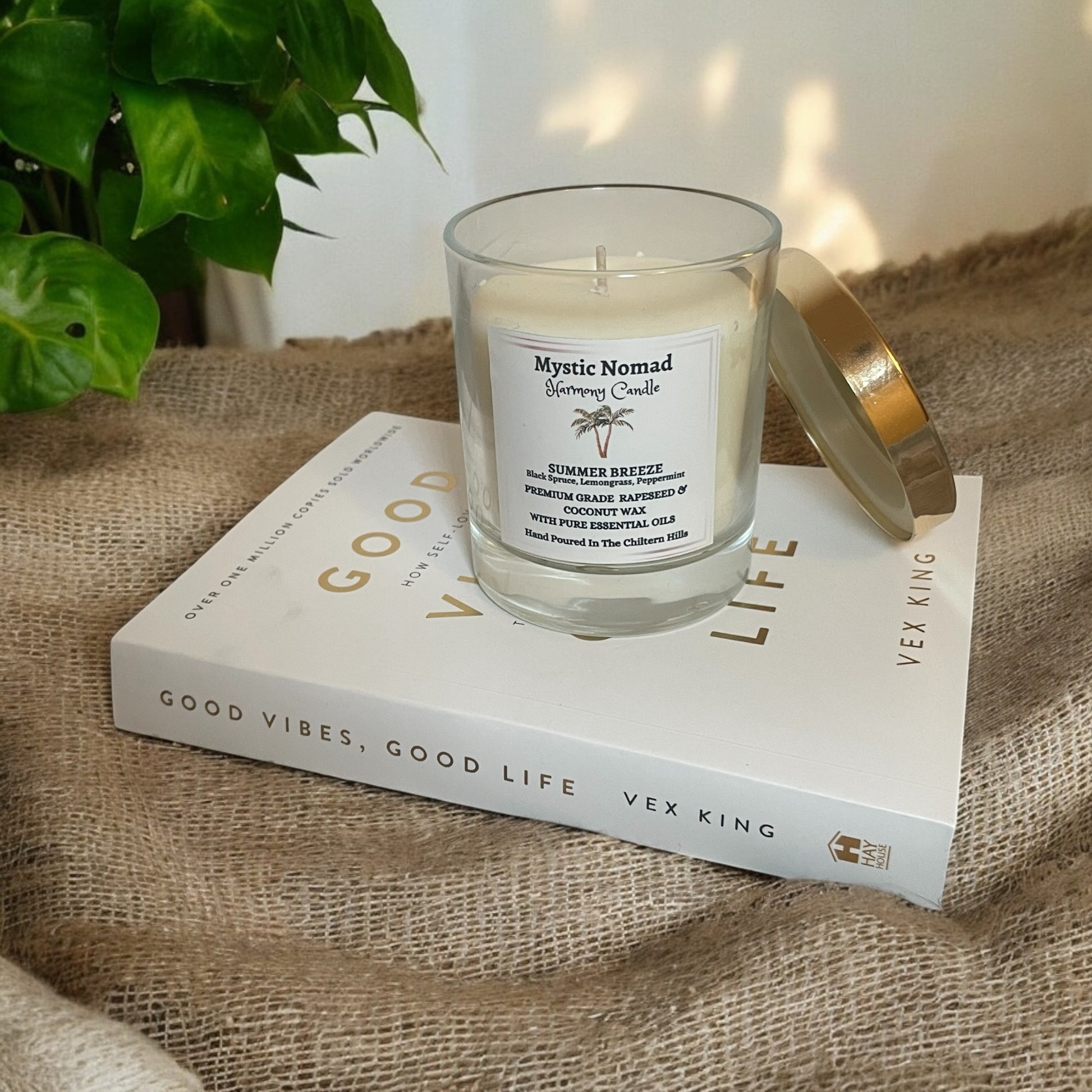 Summer Breeze Candle in a cozy home setting, filling the air with refreshing lemongrass, black spruc e and peppermint scents