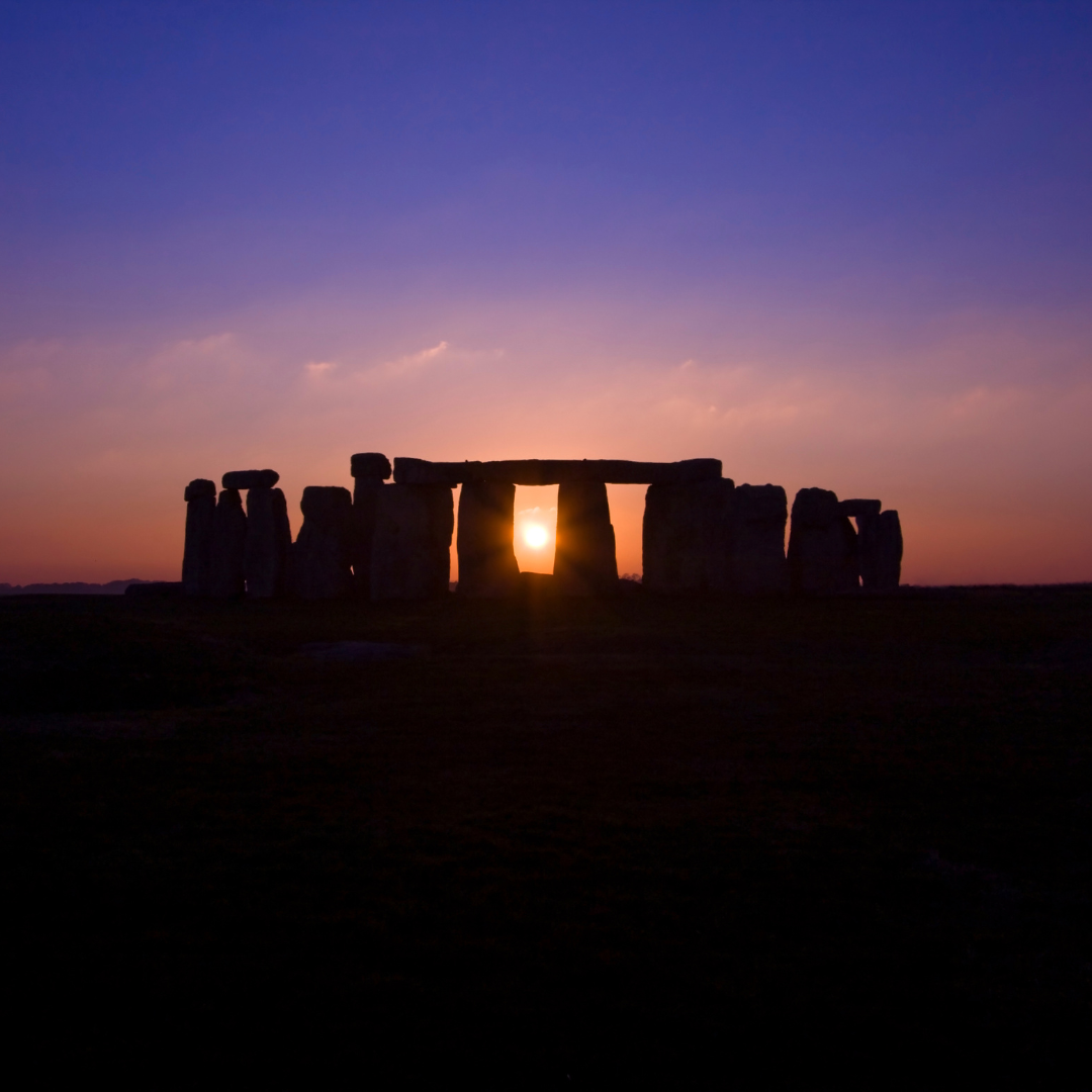 Stonehenge at night during the Winter Solstice, with stars overhead and a mystical, serene atmosphere, evoking reflection and renewal.