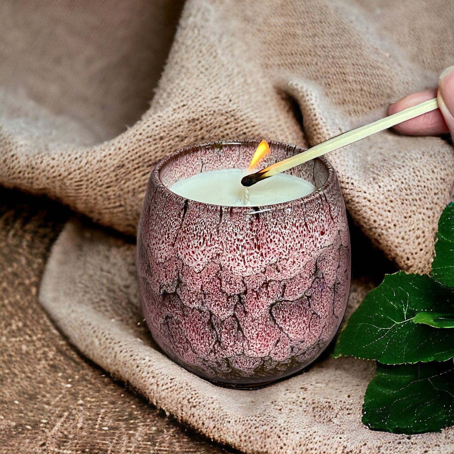 Relax & Renew lavender aromatherapy candle next to a bedside table, perfect for bedtime relaxation and sleep