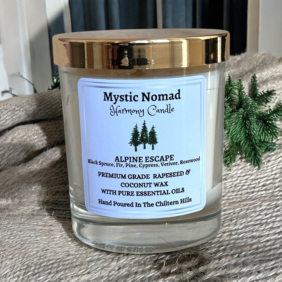 Alpine Escape aromatherapy candle in Italian glass jar with gold lid, scented with black spruce, fir needle, pine, cypress, rosewood, and vetiver