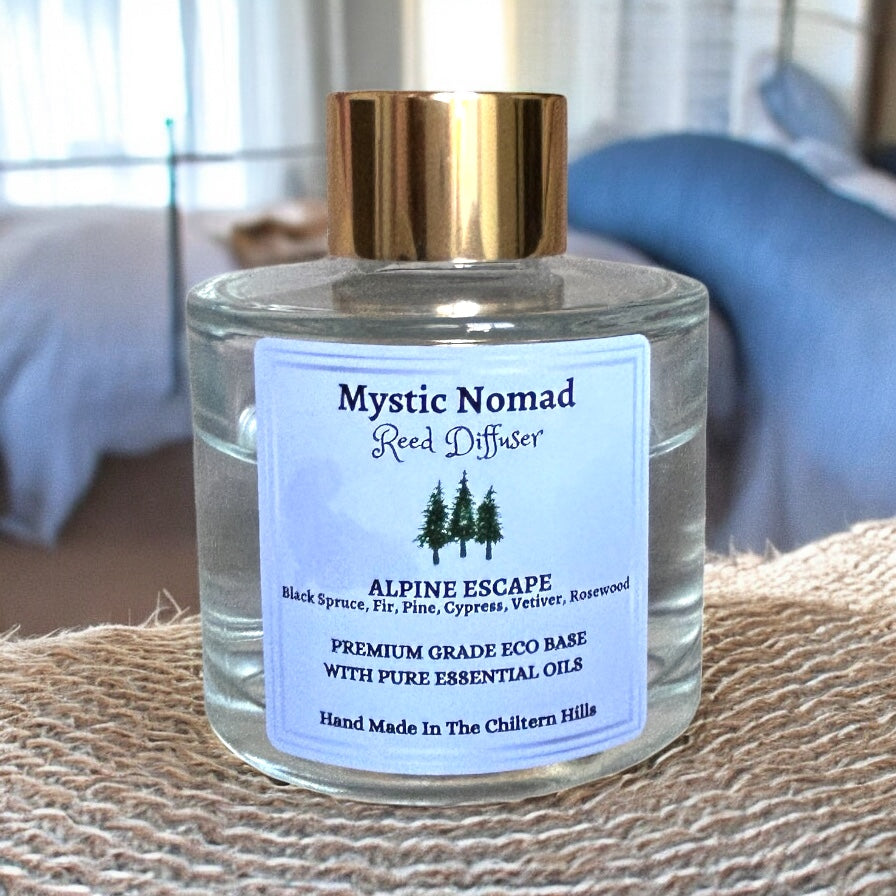 Mystic Nomad Alpine Escape aromatherapy reed diffuser in luxury Italian glass jar with gold cap, black spruce fir needle pine cypress blend