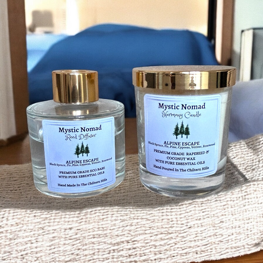 Alpine Escape aromatherapy reed diffuser paired with matching candle in luxury Italian glass jars, black spruce fir needle pine cypress essential oils