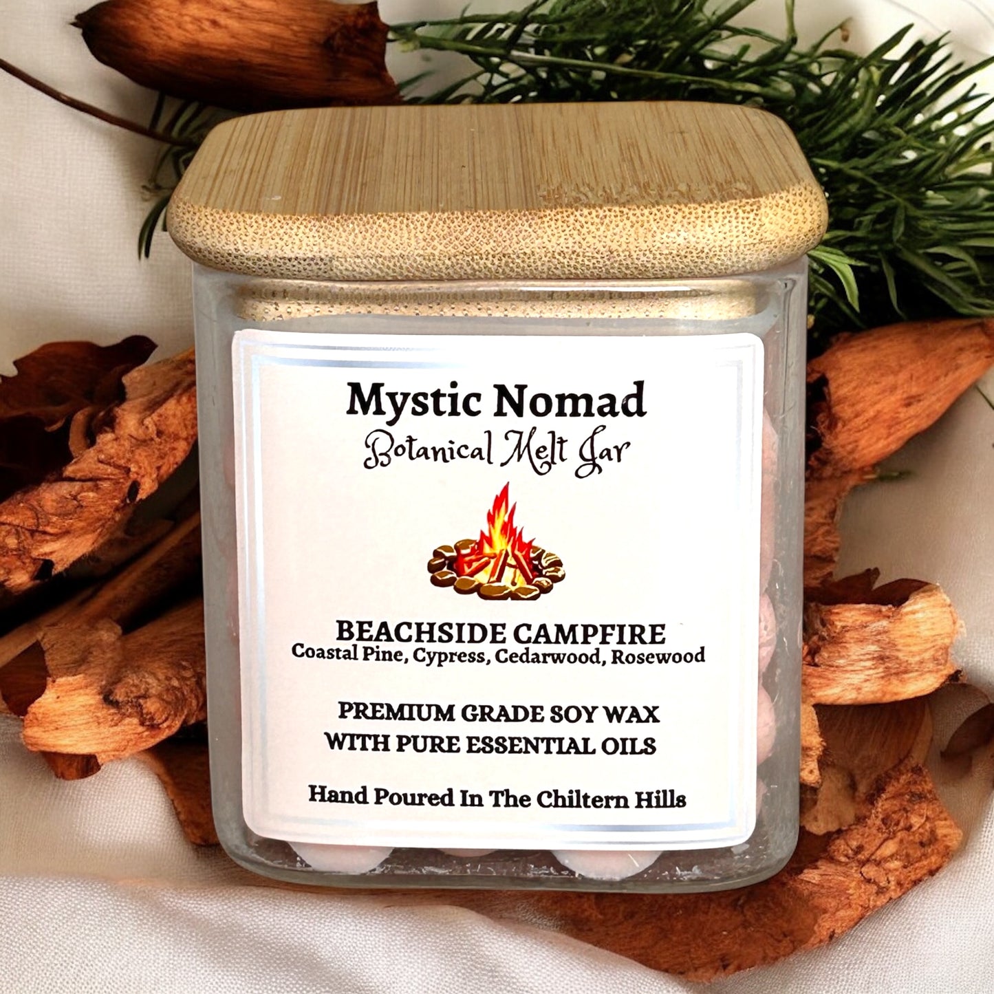 Eco-friendly wax melts in a glass jar with gold lid, showcasing coastal-inspired aromatherapy blend