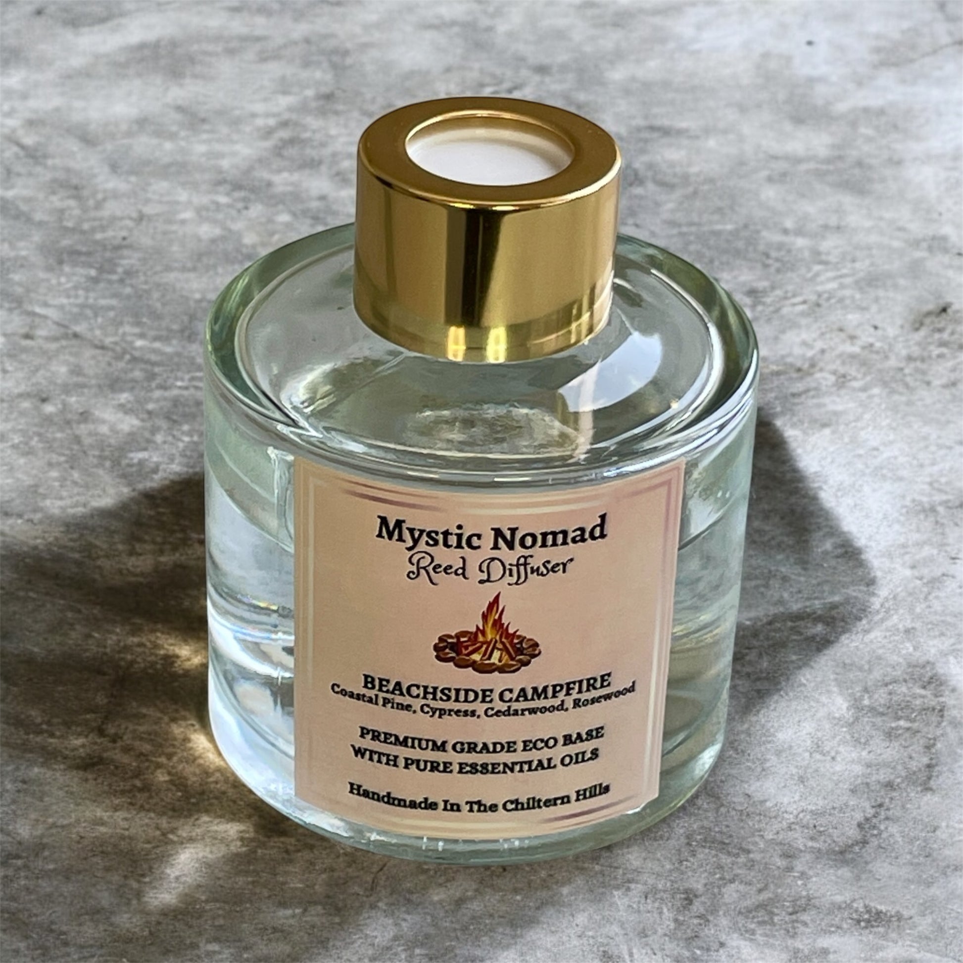 Beachside Campfire reed diffuser by Mystic Nomad with gold lid, vegan plant-based aromatherapy diffuser in luxury glass