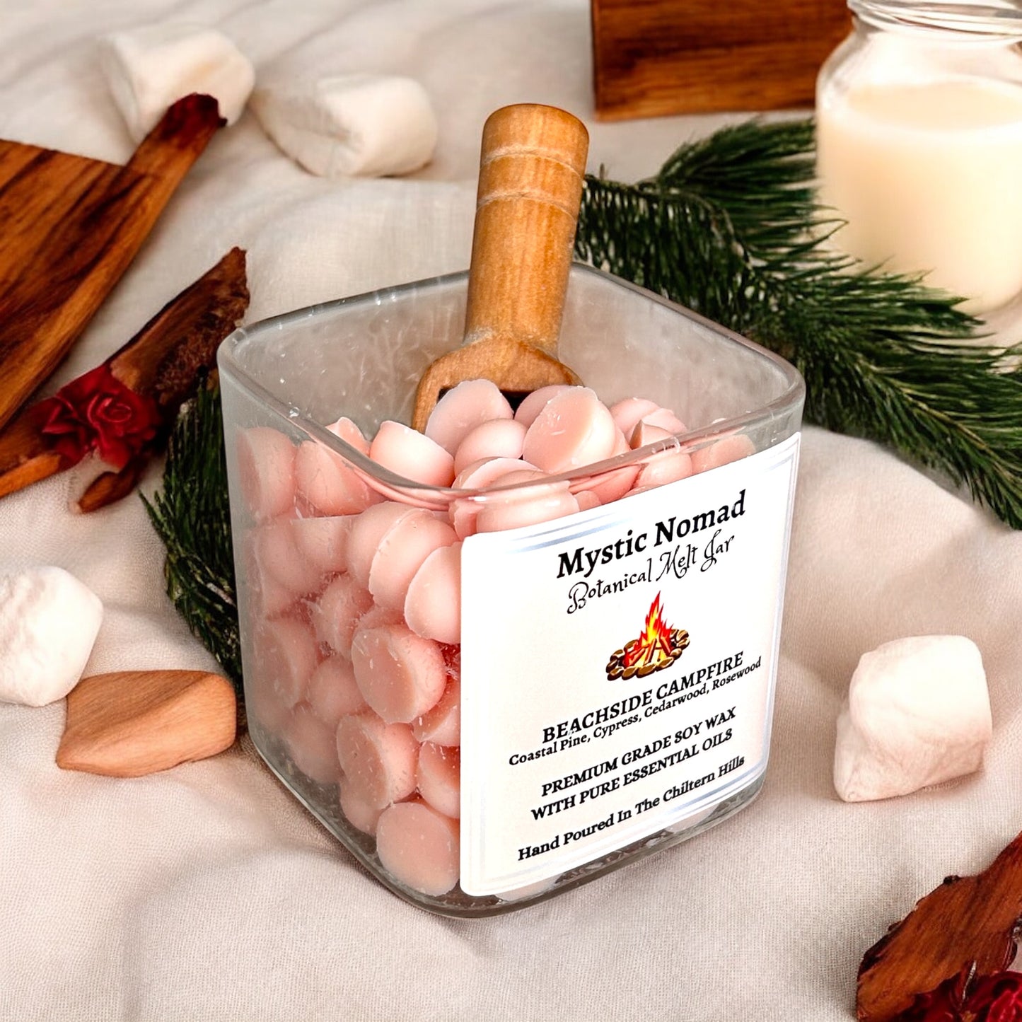 Botanical wax melt placed in burner, releasing coastal pine and campfire aroma