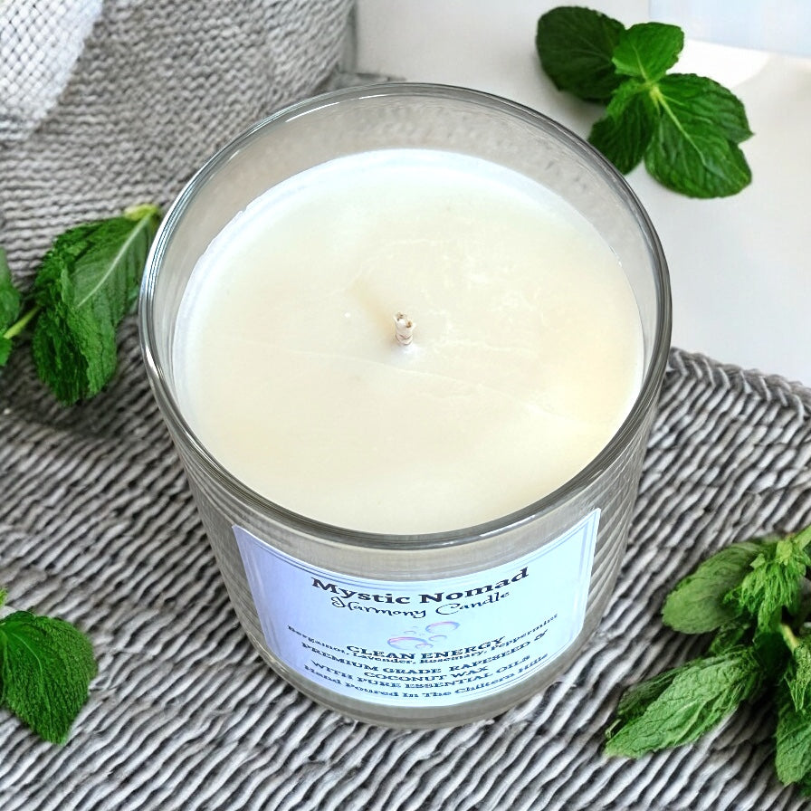 Top view of the Clean Energy aromatherapy candle showing the centred cotton wick and creamy natural wax.
