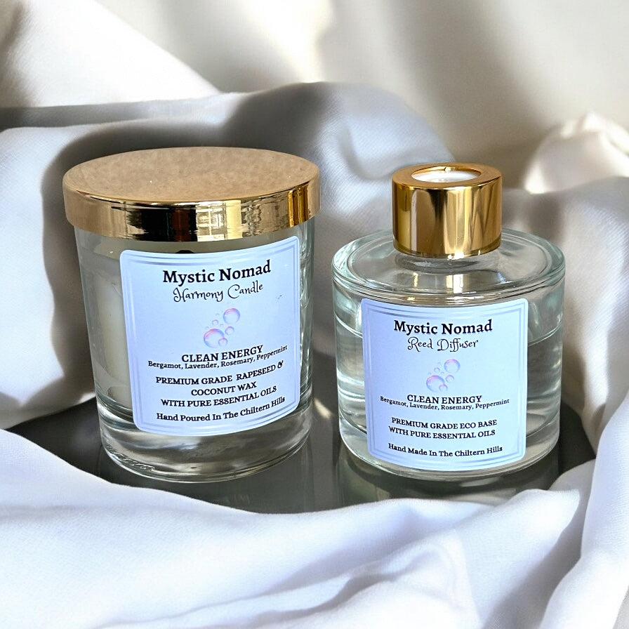 Clean Energy reed diffuser paired with matching aromatherapy candle, both hand-poured with bergamot, lavender, rosemary, and peppermint for relaxation and home cleansing