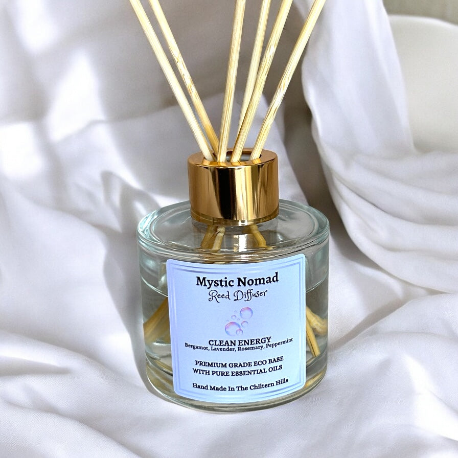 Close-up of Clean Energy reed diffuser showing natural reeds and luxury glass jar, hand-poured with eco-friendly essential oils for home mindfulness and relaxation