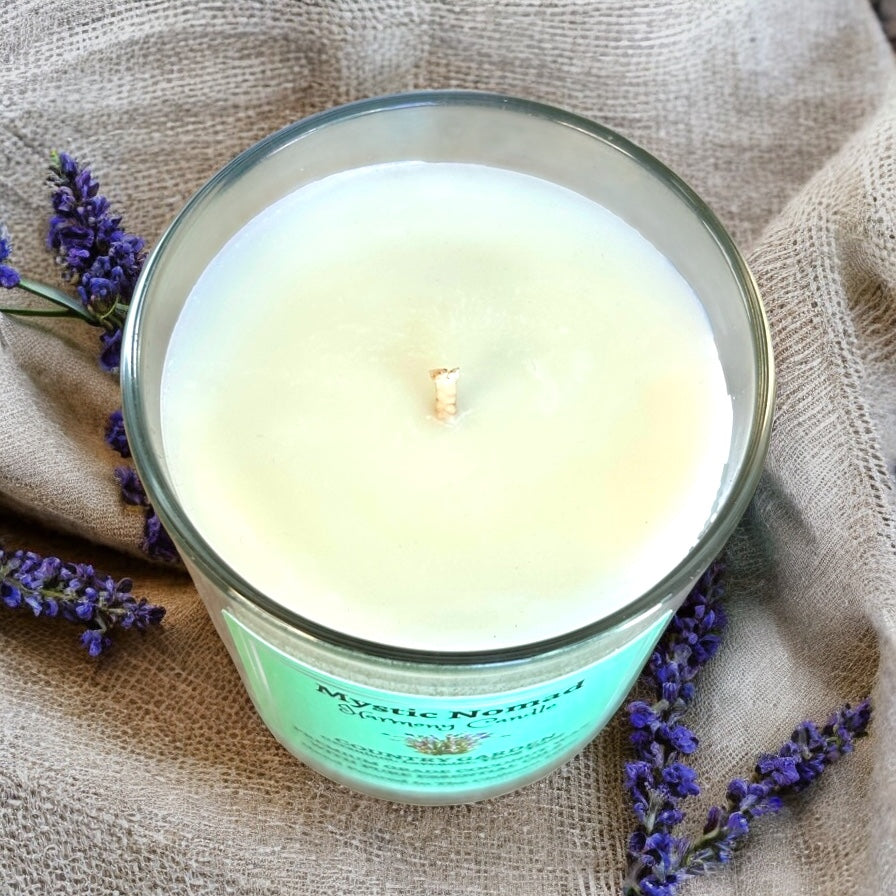 A shot of the Country Garden Candle from Mystic Nomad with the lid off, releasing its soothing, floral fragrance of geranium, lavender, and ylang-ylang essential oils