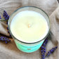 Top view of Country Garden aromatherapy candle, showing unlit cotton wick and smooth wax surface.