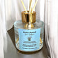 Close-up of Country Garden reed diffuser with inserted reeds highlighting floral aromatherapy oils and elegant jar