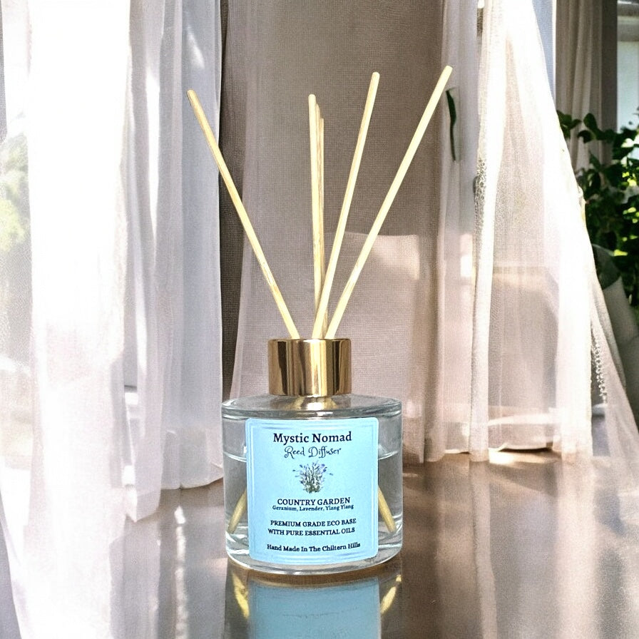 Elevated view of Country Garden reed diffuser with reeds, showing luxury Italian glass jar and floral aromatherapy blend