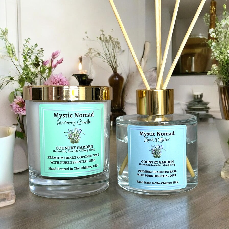 Country Garden aromatherapy reed diffuser with matching hand-poured candle, both infused with geranium, lavender, and ylang ylang essential oils in luxury Italian glass jars