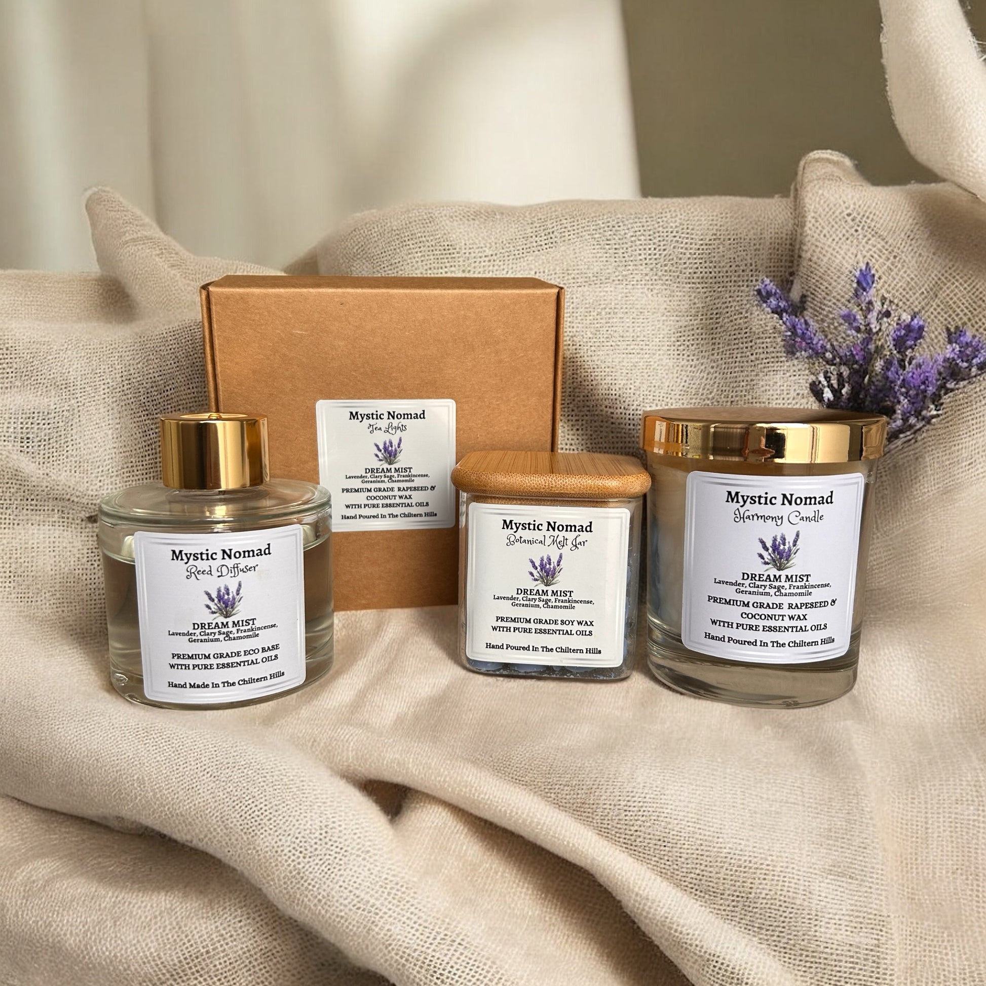 Dream Mist tea lights arranged with matching aromatherapy candle and wax melts by Mystic Nomad for a calming bedtime ritual.

