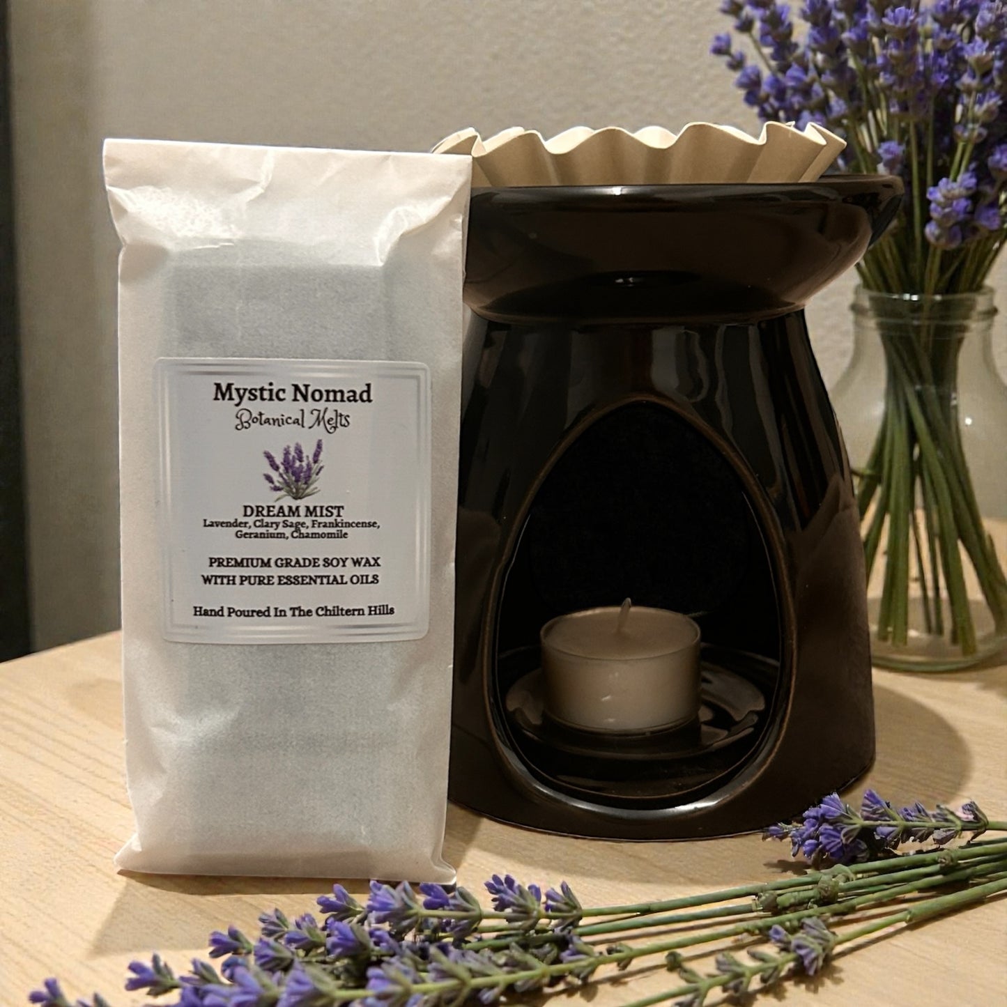 Dream Mist wax melt snap bar in a wax melt burner, releasing soothing lavender and chamomile aromatherapy fragrance.