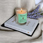 Country Garden aromatherapy candle styled on a book, luxury hand-poured floral candle for mindfulness and relaxation.