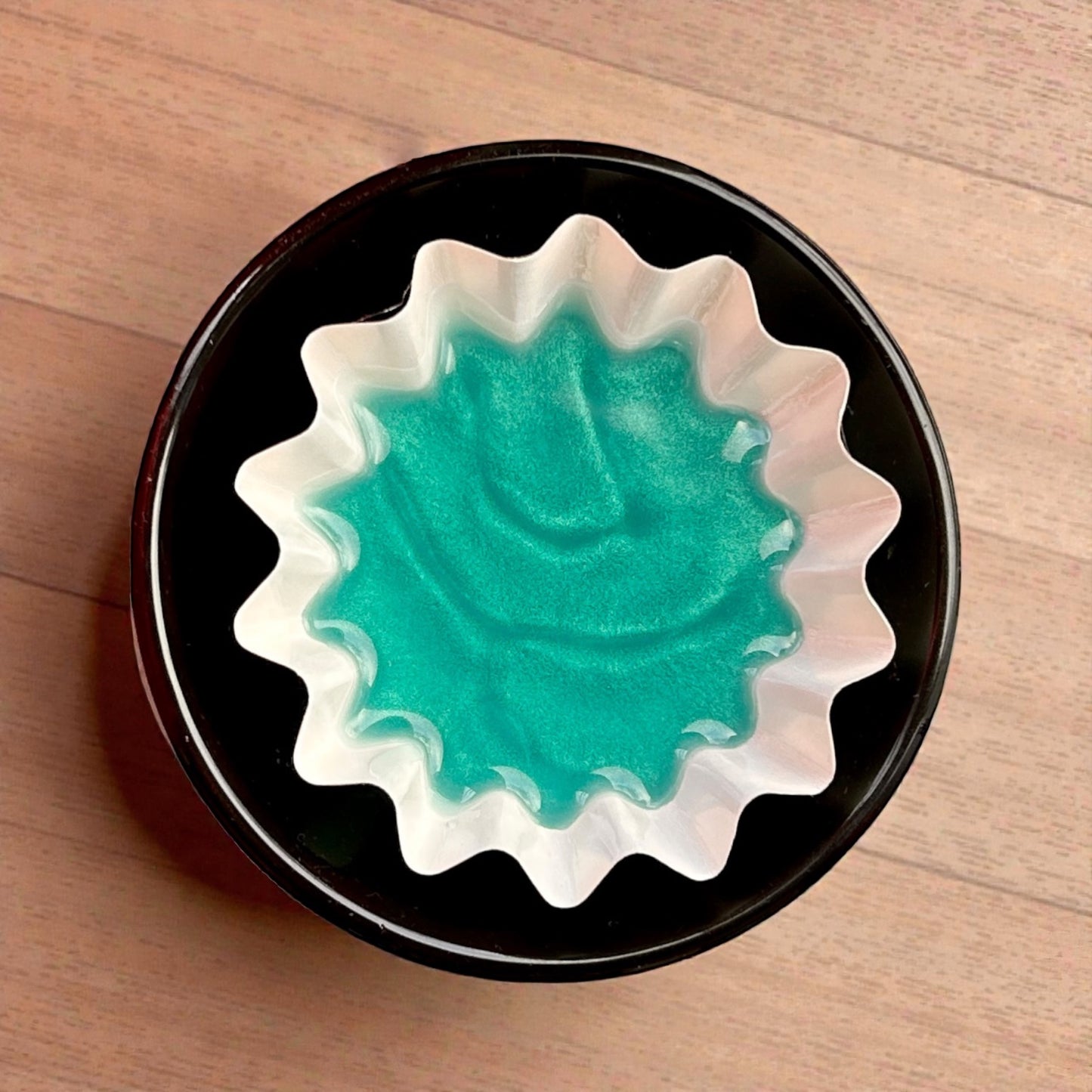 Top view of melted Alpine Escape wax in burner dish, releasing fresh woody aromatherapy scent by Mystic Nomad