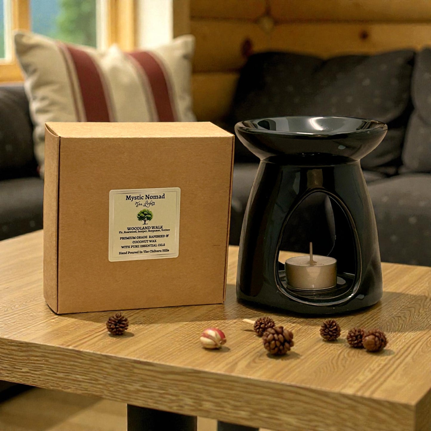 Elegant black wax melt burner on table, perfect for aromatherapy candle and essential oil rituals.