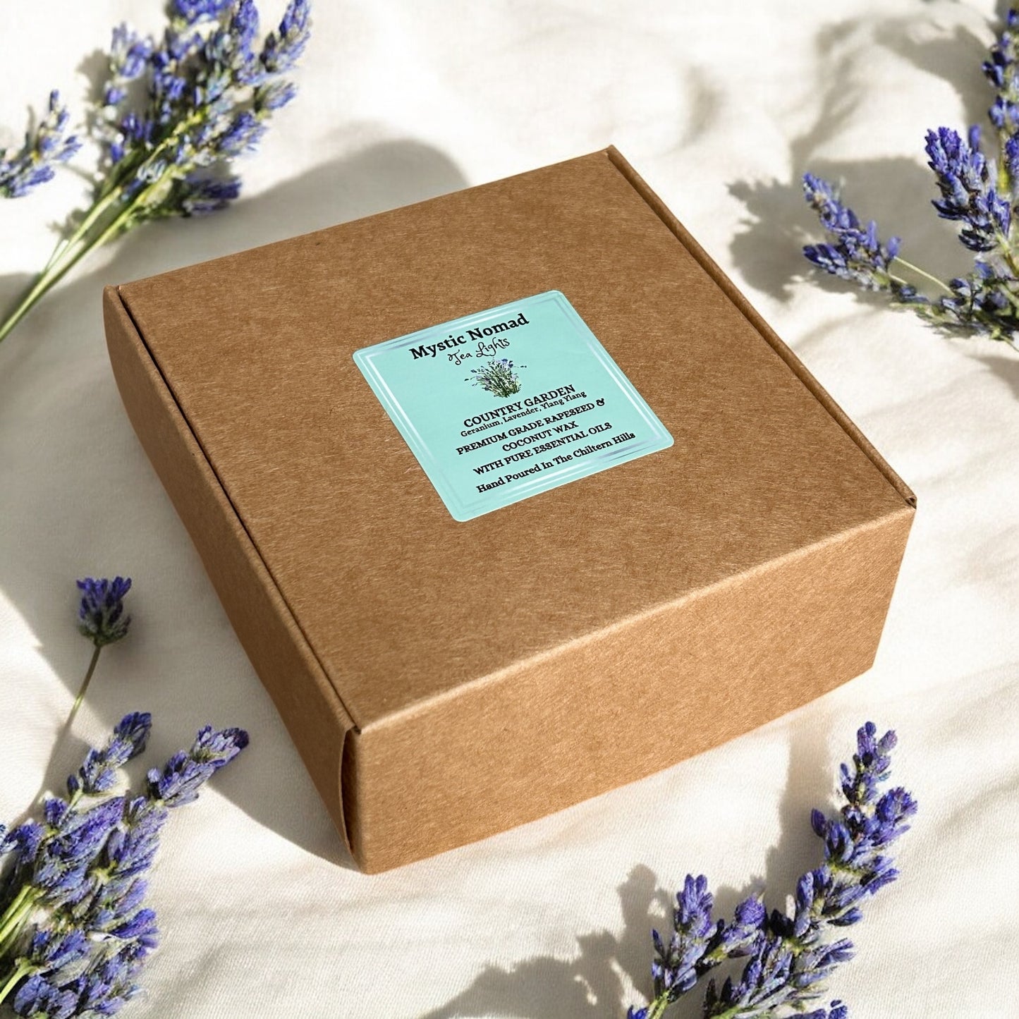 Flat lay of Country Garden aromatherapy tea lights set with floral arrangement, hand-poured essential oils