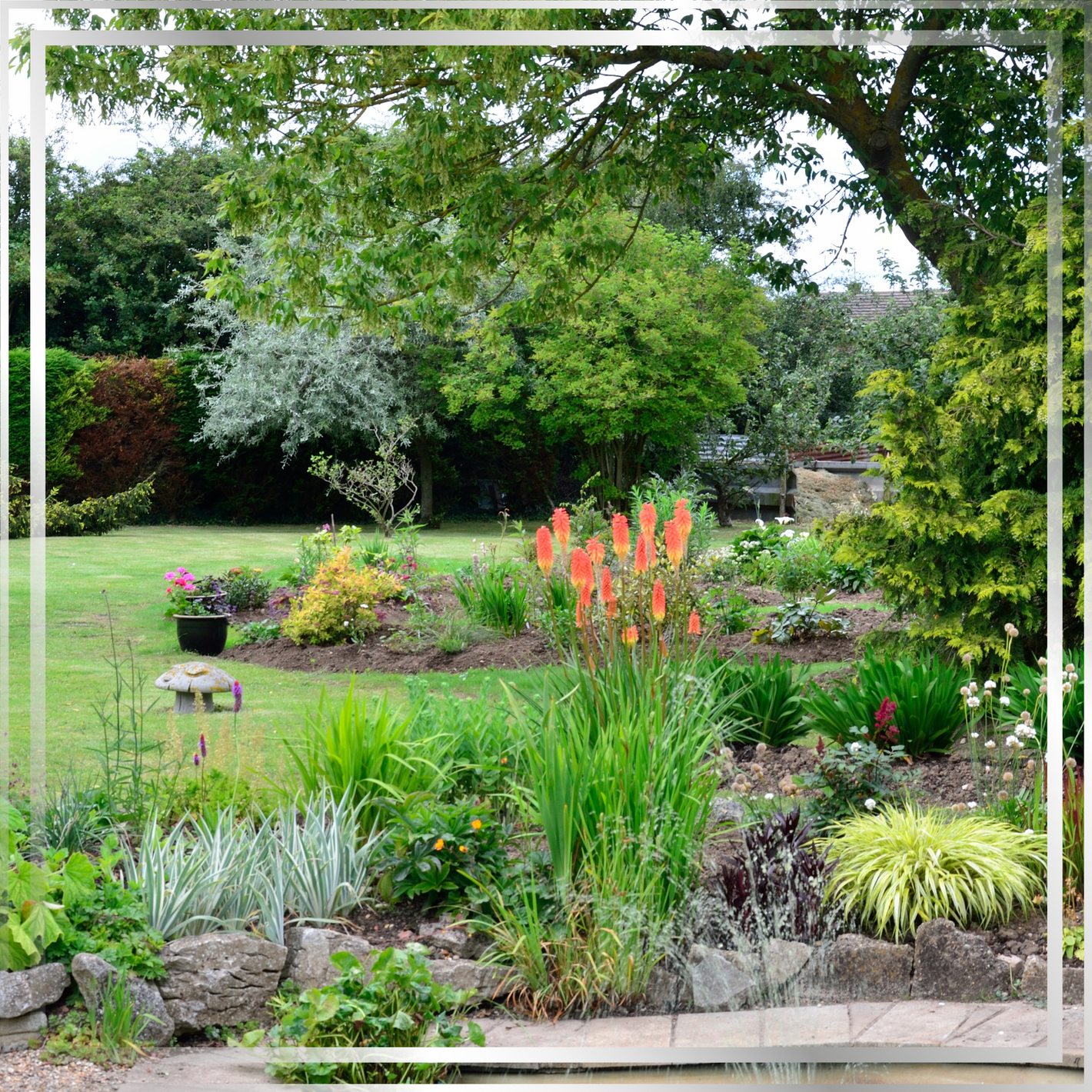 Garden scene representing wellbeing and mindfulness, reflecting Mystic Nomad’s aromatherapy candles and community support for mental wellness