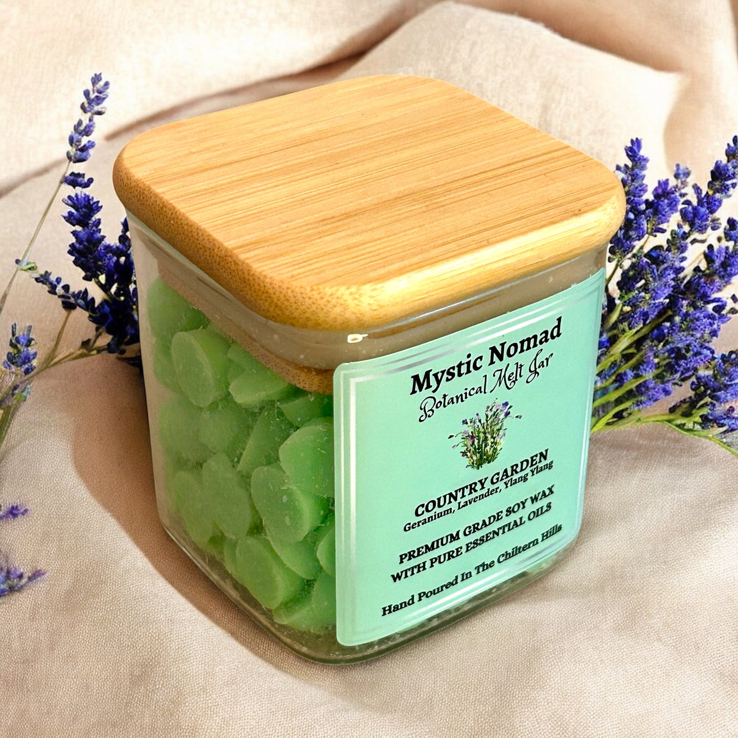 Side view of Mystic Nomad Country Garden wax melts in Italian glass jar, showcasing eco-luxe design and hand-poured floral aromatherapy blend