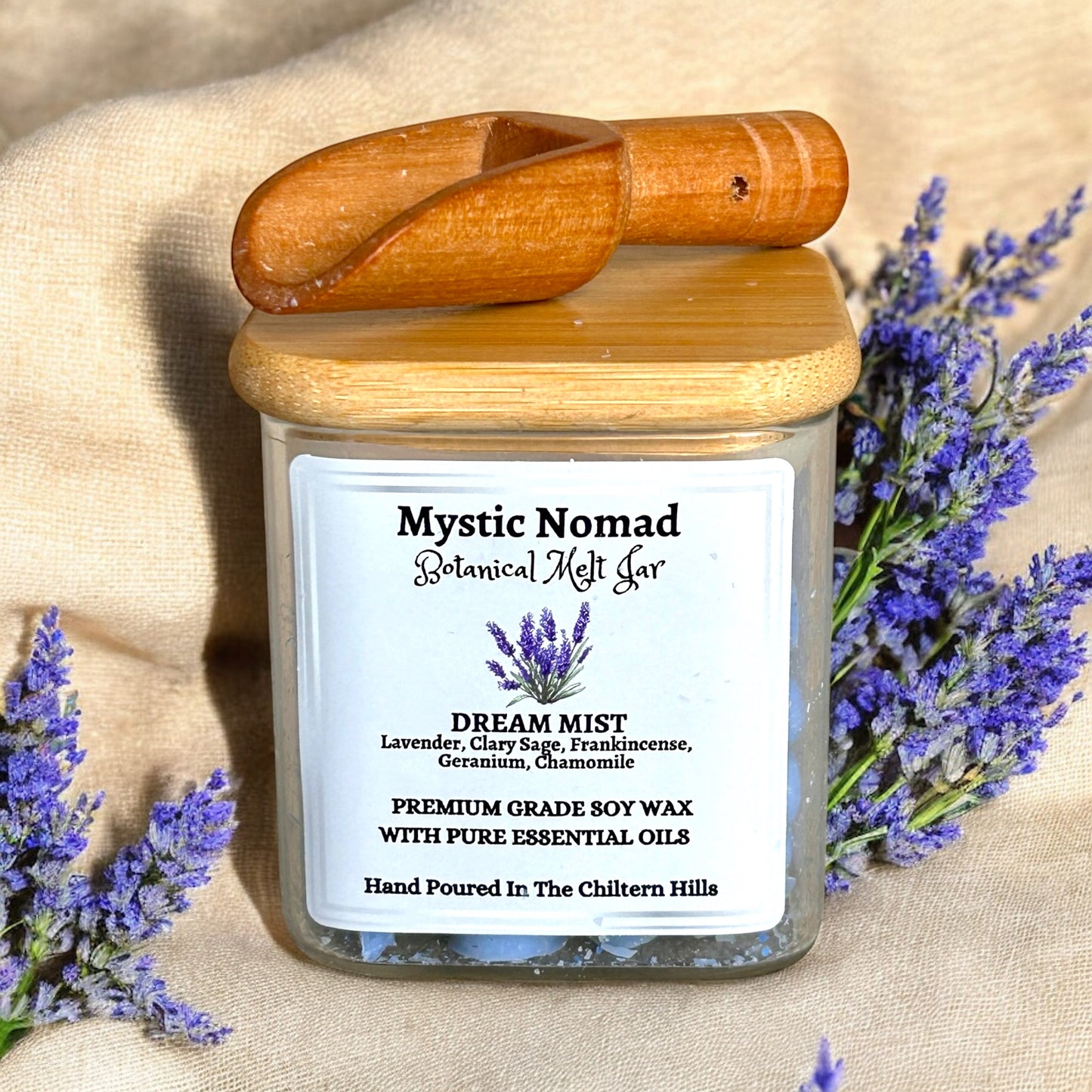 Top-down view of Dream Mist botanical wax melts jar with banboo lid