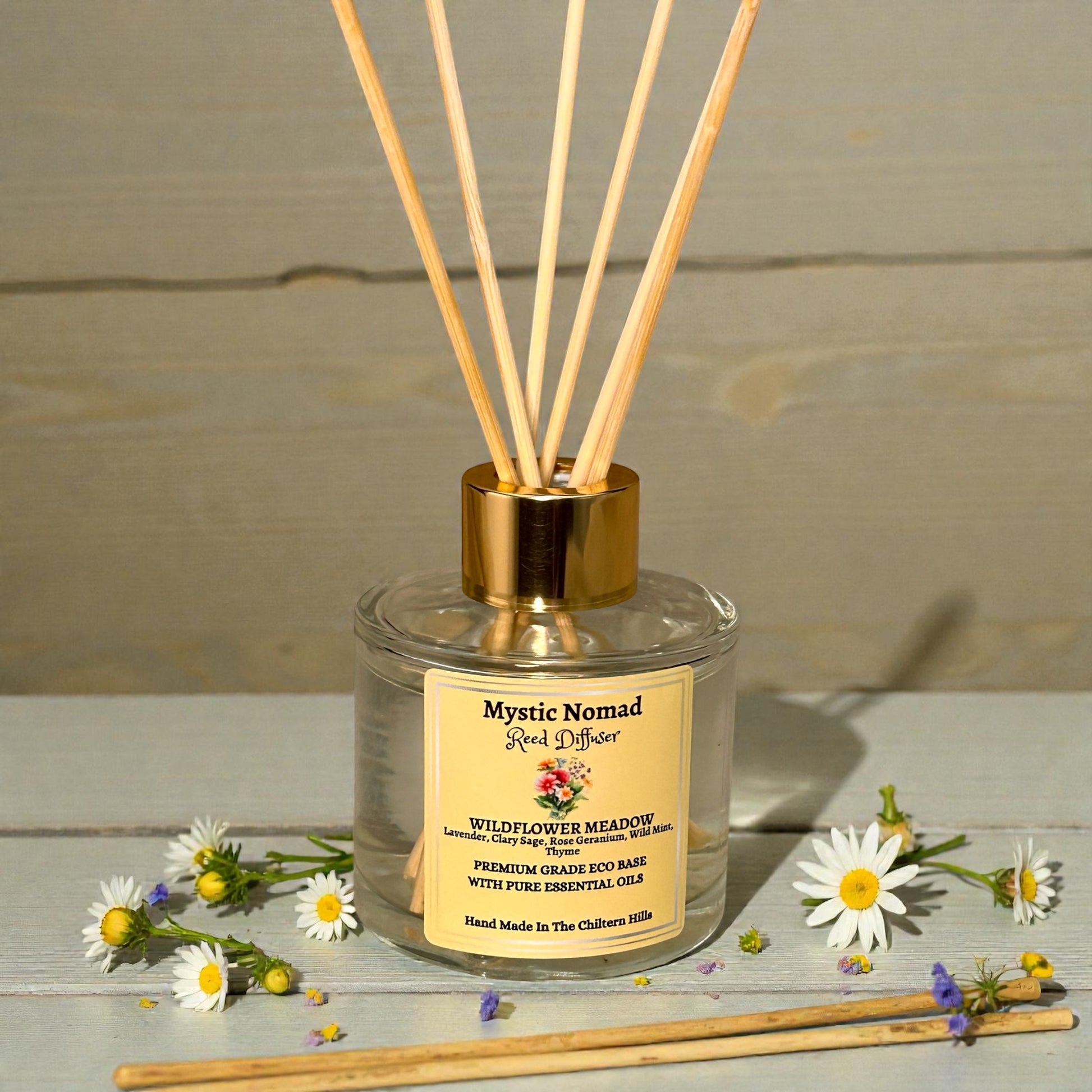 Wildflower Meadow reed diffuser by Mystic Nomad styled with flowers, showcasing our aromatherapy candles and diffusers