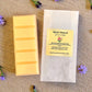 Wildflower Meadow wax melt snap bar displayed next to its eco-friendly packaging. Natural, hand-poured aromatherapy wax melt by Mystic Nomad.