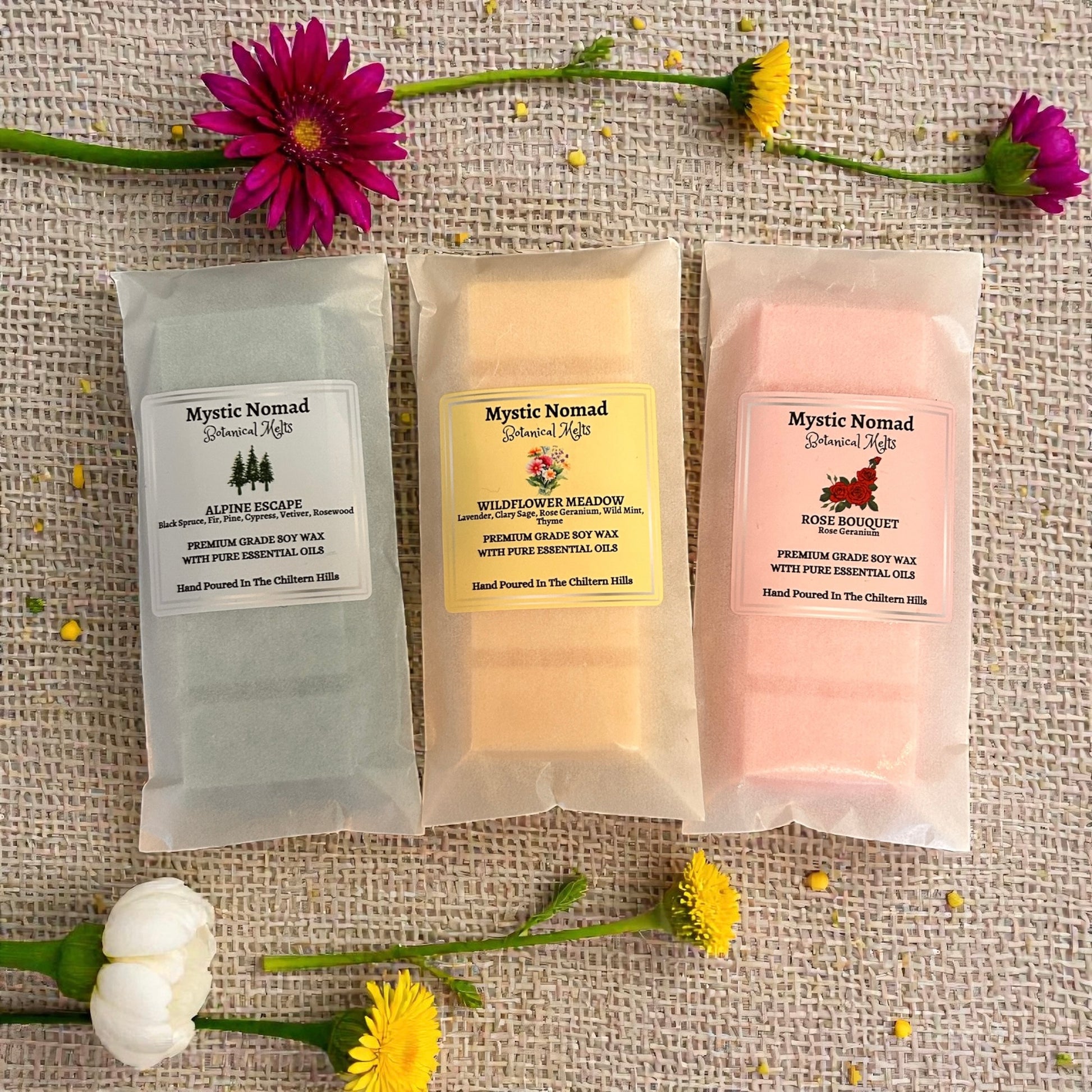 Wildflower Meadow wax melt snap bar from Mystic Nomad displayed alongside other aromatherapy wax melts. Hand-poured, eco-friendly and relaxing.