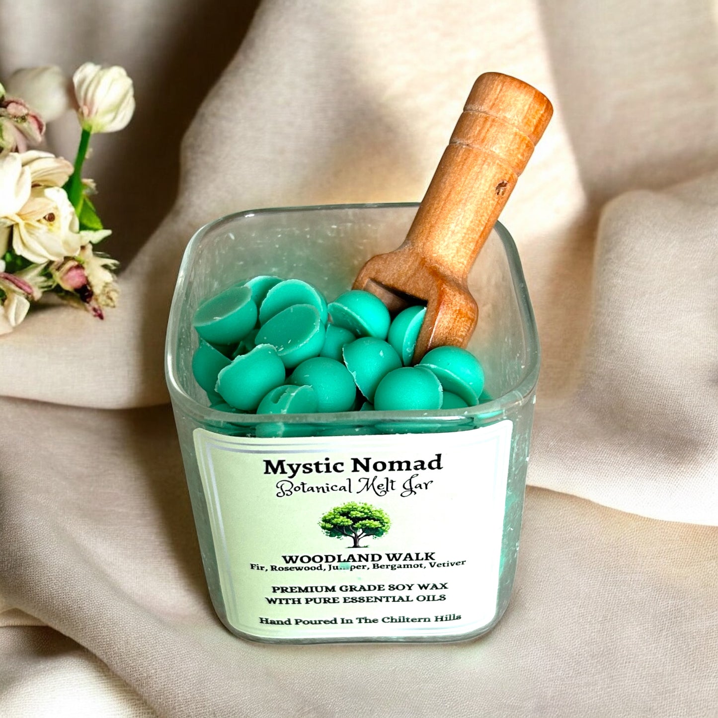Open Woodland Walk botanical wax melts jar showing natural soy melts infused with fir, juniper, and vetiver.