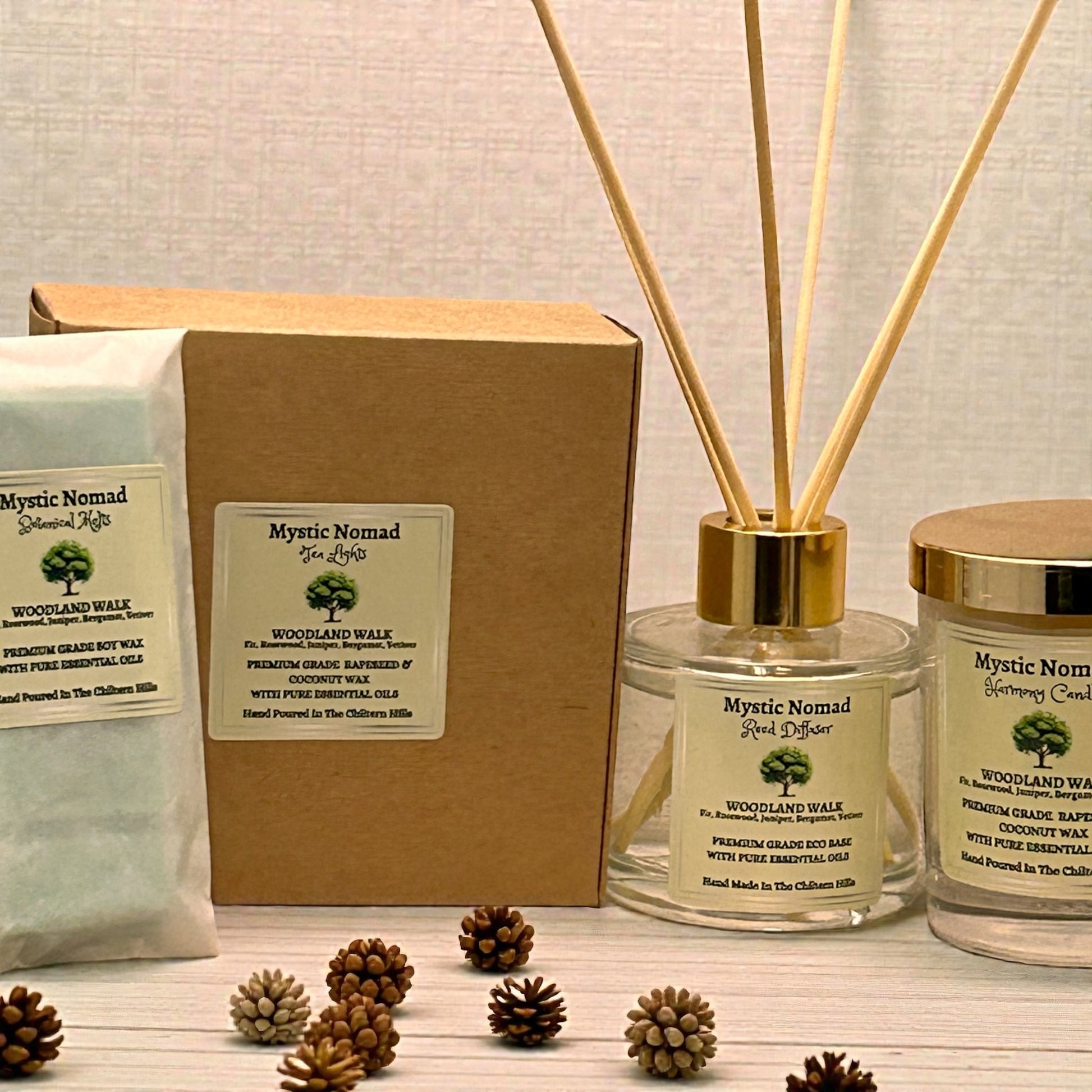 Woodland Walk reed diffuser alongside matching candle and wax melt snap bar for a layered aromatherapy experience