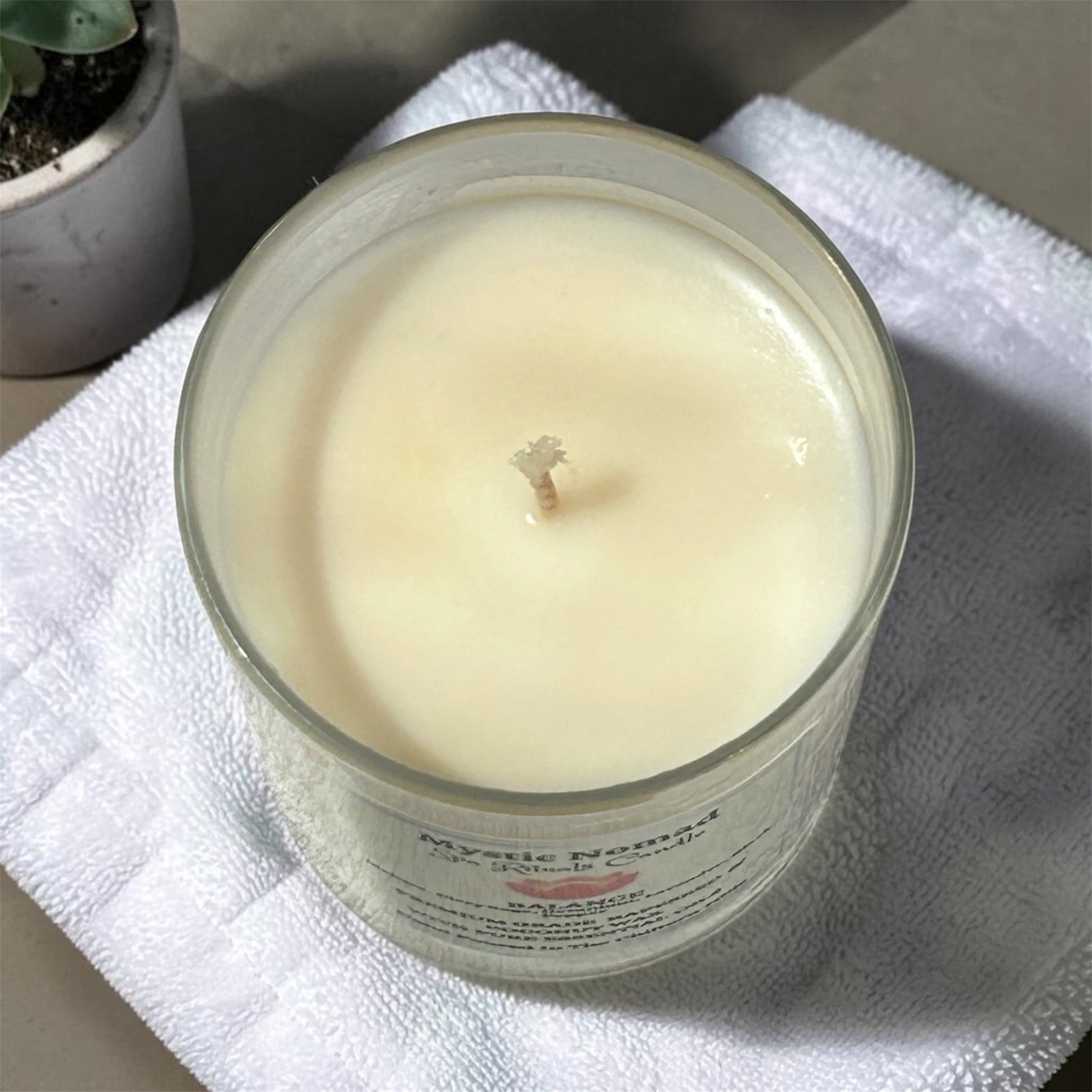 mystic nomad aromatherapy candle balance for top view of wax 