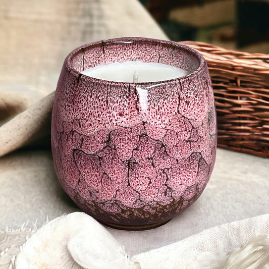 Relax & Renew lavender aromatherapy coffee cup candle styled on a soft blanket beside a woven basket for a calming bedtime atmosphere.