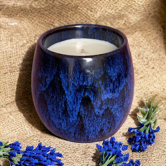 Reset and Unwind coffee cup candle with calming essential oils, styled in a cosy rustic setting.