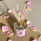 Close-up of Rose Bouquet reed diffuser with floral details, highlighting hand-poured craftsmanship and natural aromatherapy ingredients.