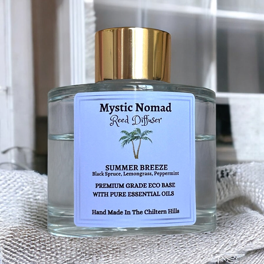 Mystic Nomad Summer Breeze aromatherapy reed diffuser in luxury Italian glass jar with gold cap, black spruce lemongrass peppermint blend