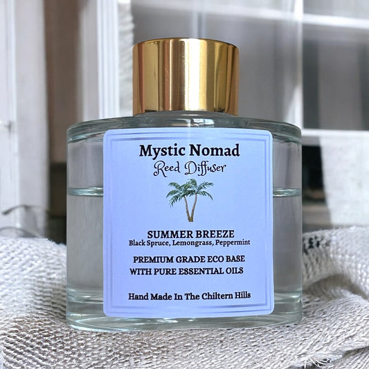 Mystic Nomad Summer Breeze aromatherapy reed diffuser in luxury Italian glass jar with gold cap, black spruce lemongrass peppermint blend