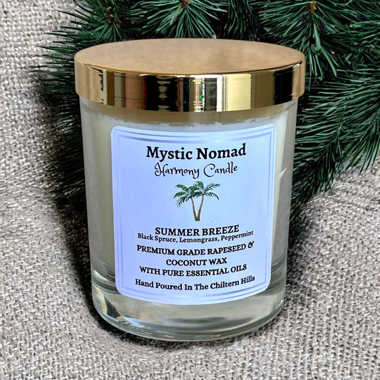 Summer Breeze aromatherapy candle in luxury Italian glass jar with gold lid, hand-poured eco-friendly candle with black spruce, lemongrass, and peppermint essential oils.