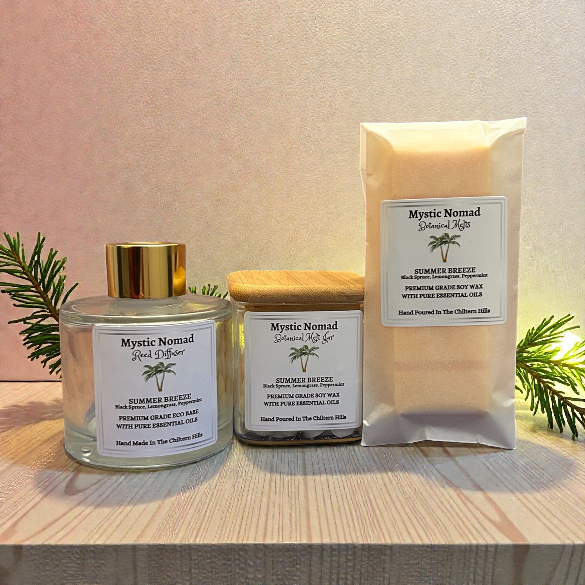 Summer Breeze aromatherapy snap bar styled with coordinating candle jar and reed diffuser, creating a complete summer scent set