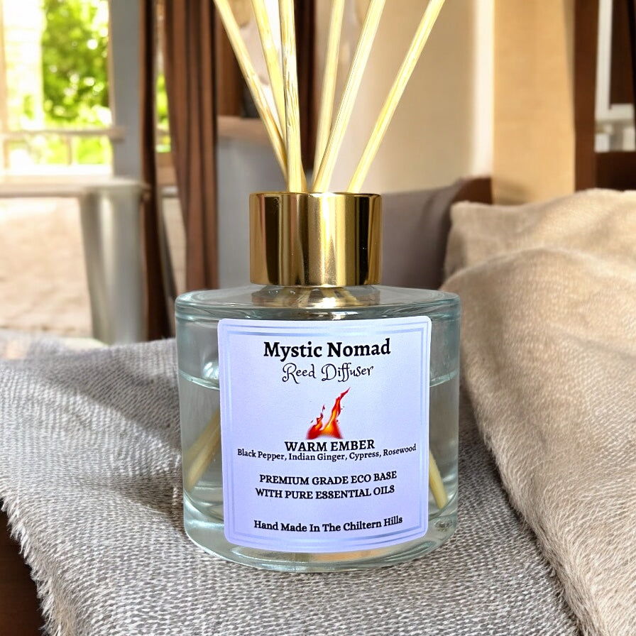 Elevated view of Warm Ember reed diffuser by Mystic Nomad Aromatherapy, showing luxury glass jar, natural reeds, and eco-friendly, hand-poured essential oils