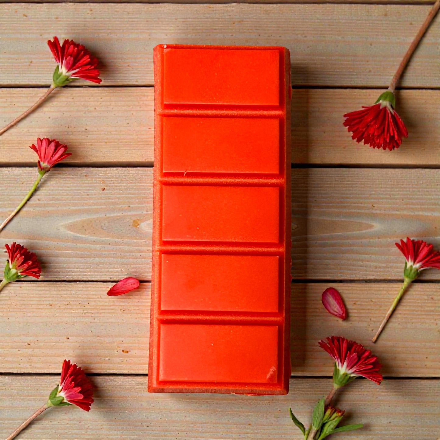 Hand-poured Warm Ember aromatherapy wax melt snap bar with essential oils on wooden surface, showcasing the bold, grounding fragrance of Black Pepper, Ginger, Cypress, and Rosewood.