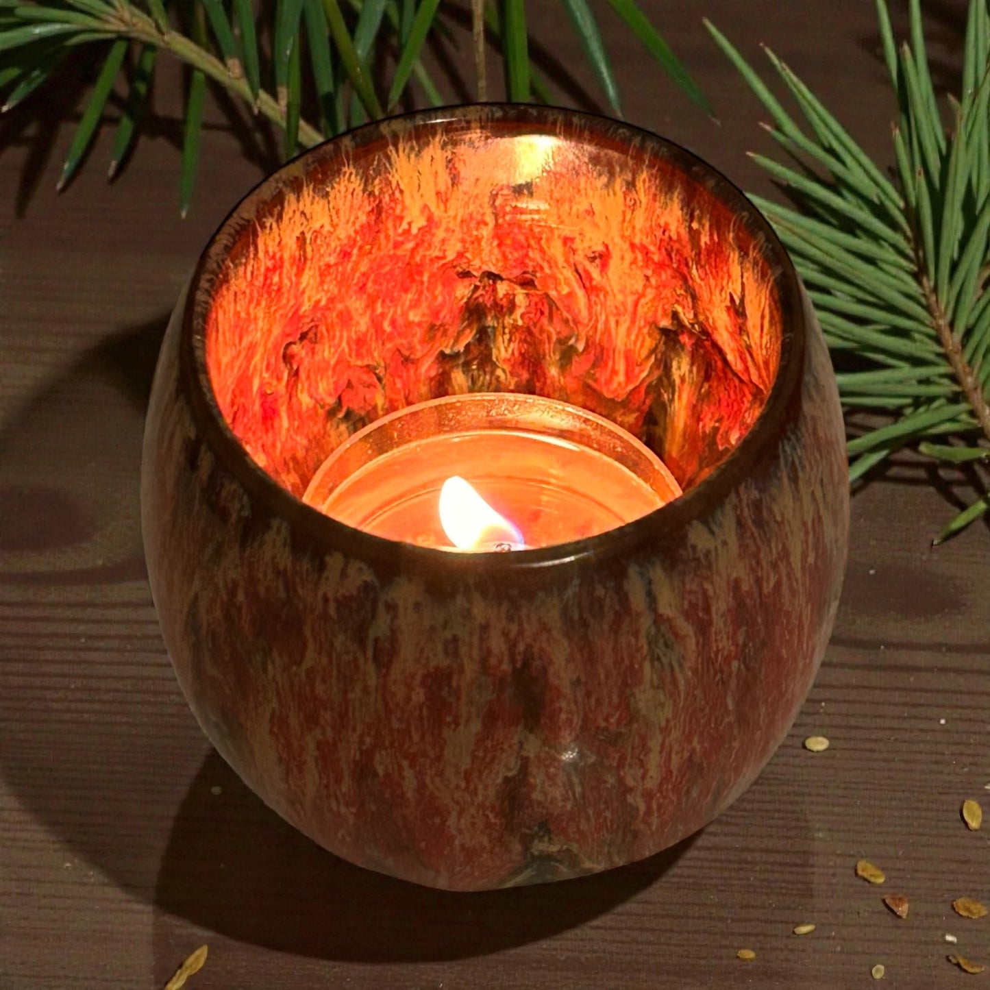 Woodland Walk aromatherapy tea light with essential oils burning in ceramic holder for calming forest-inspired ambience